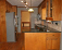 Updated kitchen with granite countertops, tile backsplash, ss appliances, hardwood floors. no image