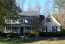 Nicely maintained traditional home with rocking chair front porch. no image