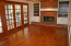 Large family room with built-in cabinets, fireplace with gas starter, custom moulding. no image