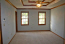 Large master gedroom with trey ceiling, large bath and walk-in closet with custom closet system. no image