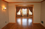 Separate living room and dining room with hardwood floors and custom moulding. no image