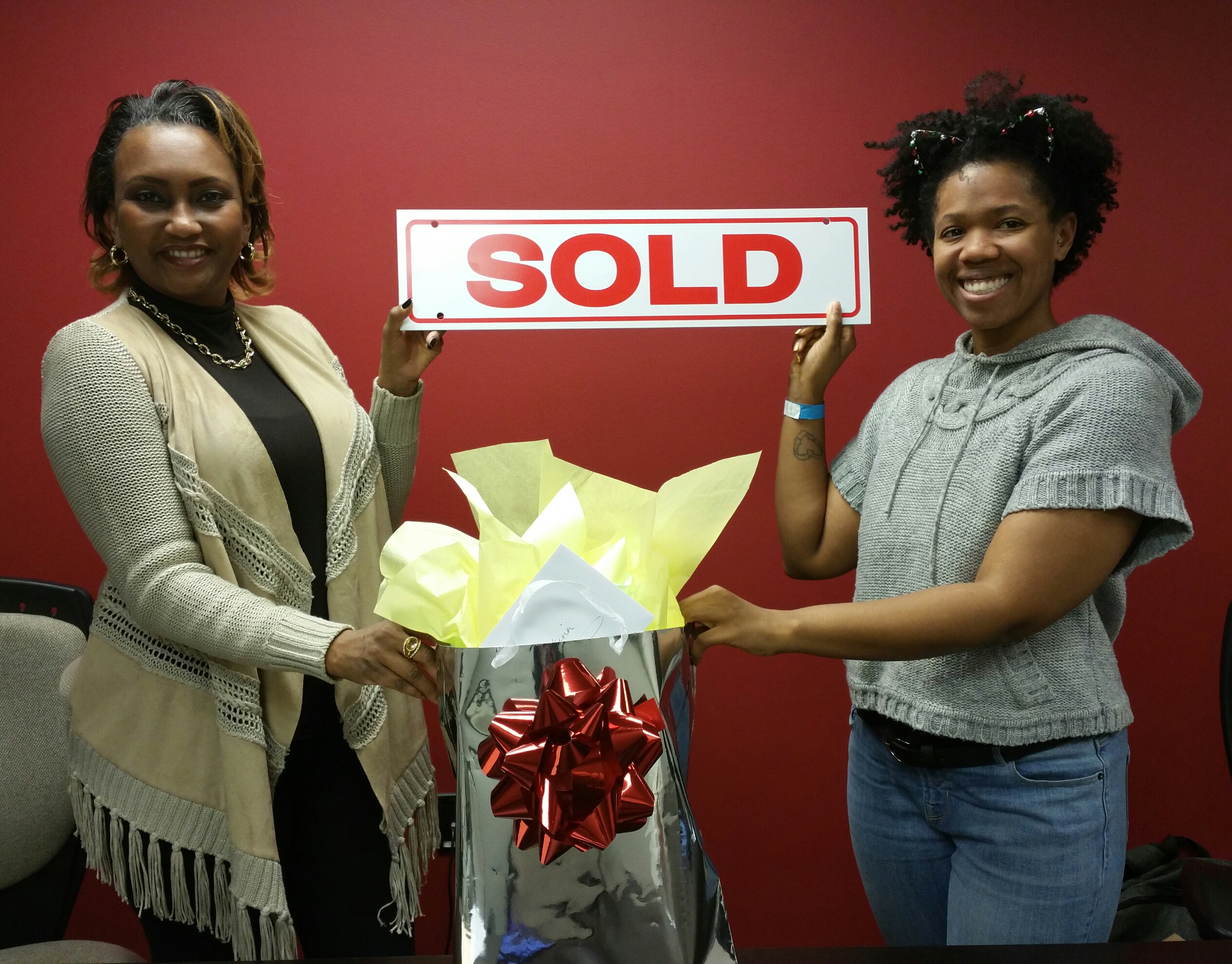 Sold sign with Leslie Ashford and Client